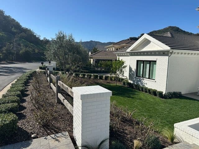 Project Elegant Landscape Design for Modern White Brick Home image