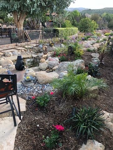 Serene Garden Retreat with Stone Paths and Water Feature image