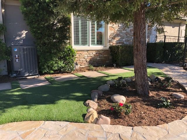 Gallery photos for Backyard Oasis with Artificial Grass and Stone Paths: Image #2